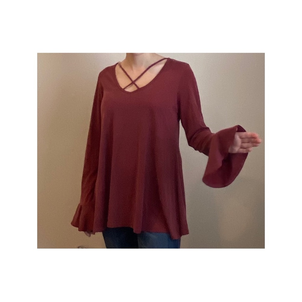 A beautiful Burgundy top with flare sleeves.